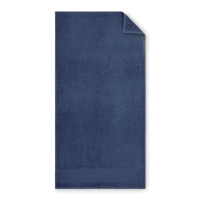 A navy blue towel with a corner fold and a hanging loop. Includes a simple design with no visible logos.