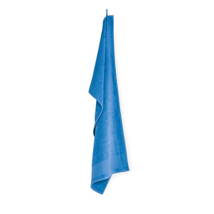 A blue towel hanging with a smooth texture, featuring a hanging loop at the top. The towel has a simple design.