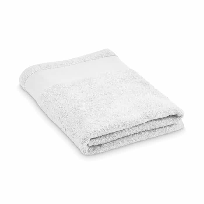 A folded white towel with a soft texture, featuring a plain design and a bordered edge.