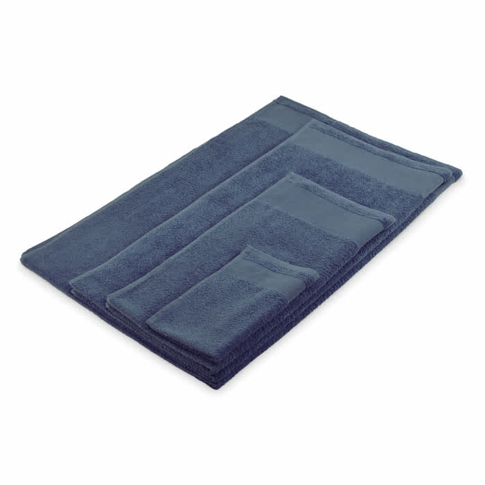 A set of navy blue towels of varying sizes, neatly arranged in a flat layout. The towels have a soft, plush texture.
