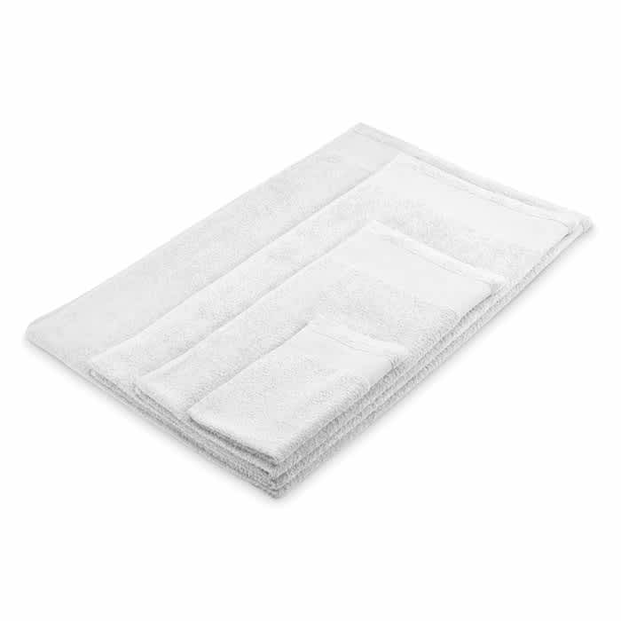 A set of white towels of varying sizes, neatly arranged on a flat surface, with a soft, fluffy texture.