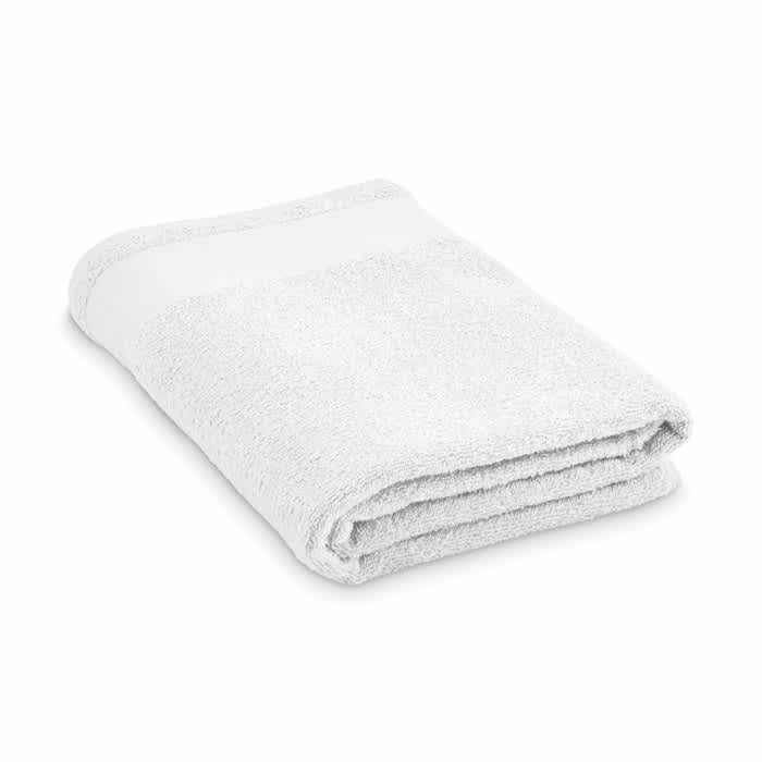 A folded white towel with a textured surface and a plain band at one end, featuring a simple design.