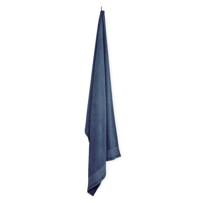 A navy blue towel hanging from a hook, showcasing a smooth texture and a classic design.