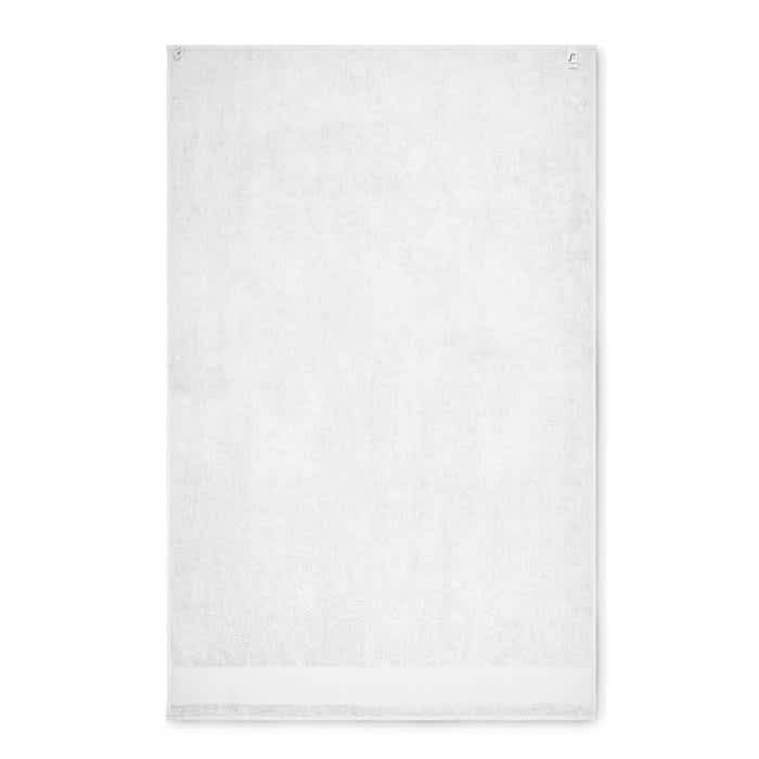 A white towel with a textured surface and no visible branding or patterns.
