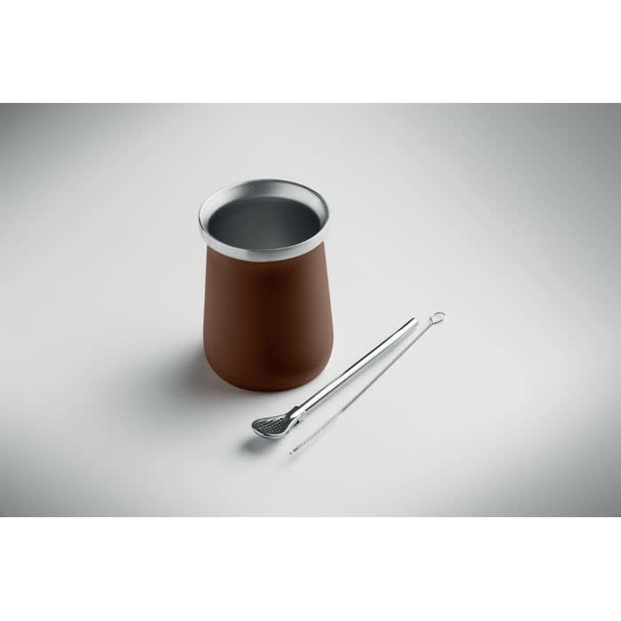 A drink bottle with a brown exterior and silver rim, accompanied by a pair of silver tongs.