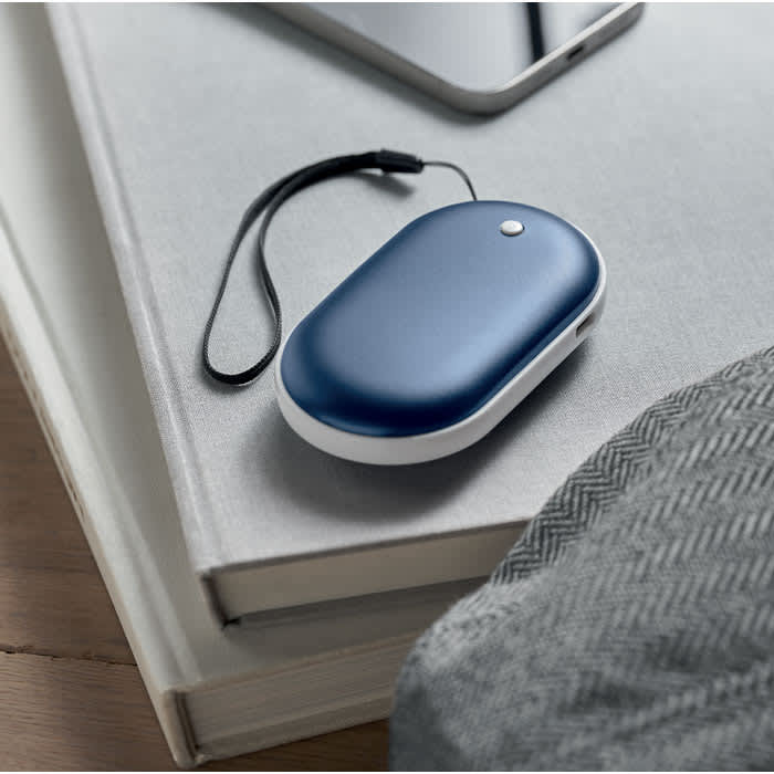 A portable device in navy blue with a sleek design, featuring a wrist strap and a small button.