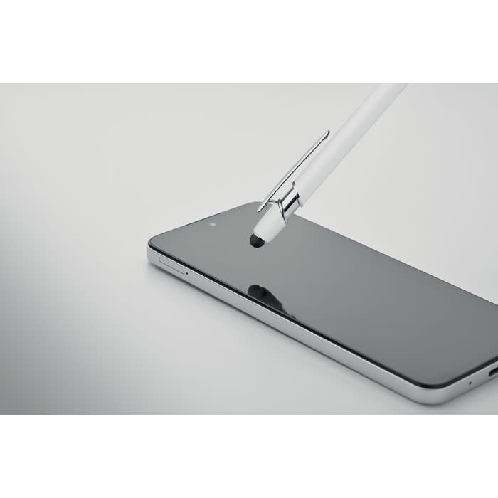 A sleek white pen hovering above a modern black smartphone with a glossy screen. The pen features a metal clip.