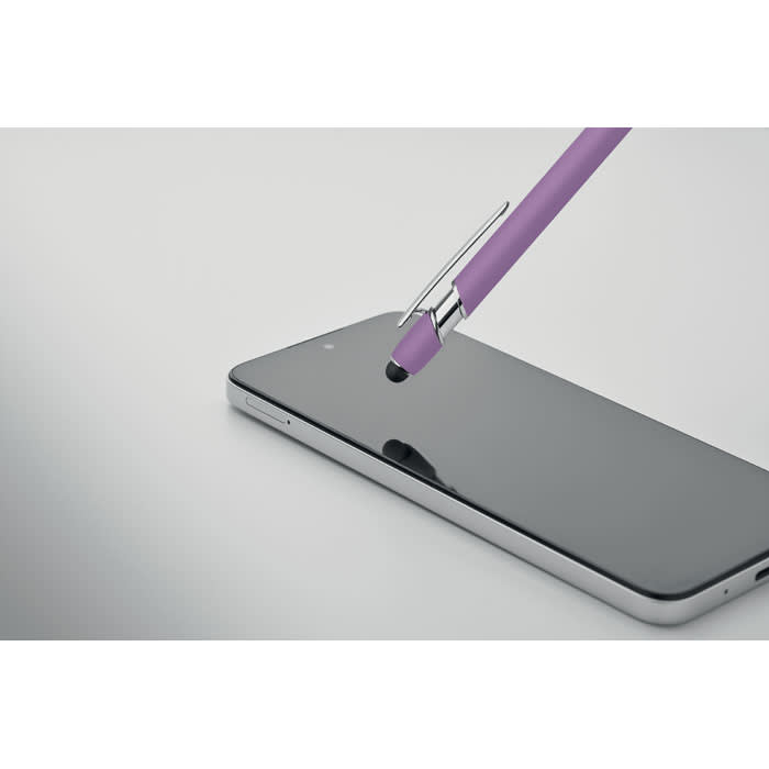 A purple pen rests on a sleek smartphone, highlighting its smooth, reflective surface.