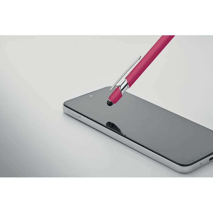 A pink pen resting on the screen of a sleek black smartphone, with a simple and modern design.