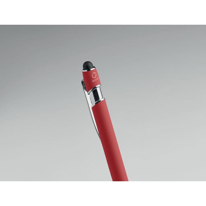 A red pen with a black tip and a clear clip, featuring a small logo on the top.