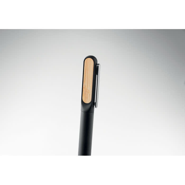 A sleek black pen with a wooden accent on the top, featuring a clip for attachment.
