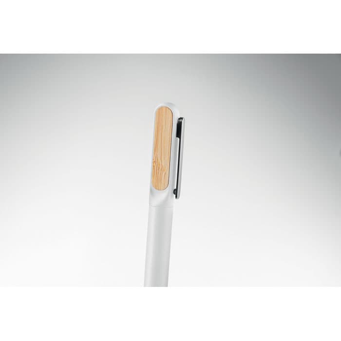 A pen with a white body and a bamboo accent, featuring a clip for securing it. It has a simple, modern design.