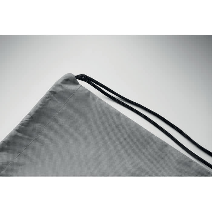 A grey drawstring bag with black cords at the top corner. The bag has a textured surface and a clean design.
