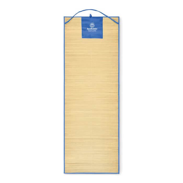 A sun lounge mat in beige with a blue top and a logo on it. The mat is rolled out flat and has a hanging strap.