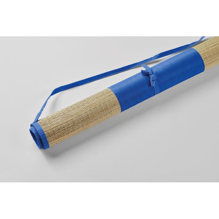 A rolled mat with a natural fibre surface and blue straps for easy carrying.