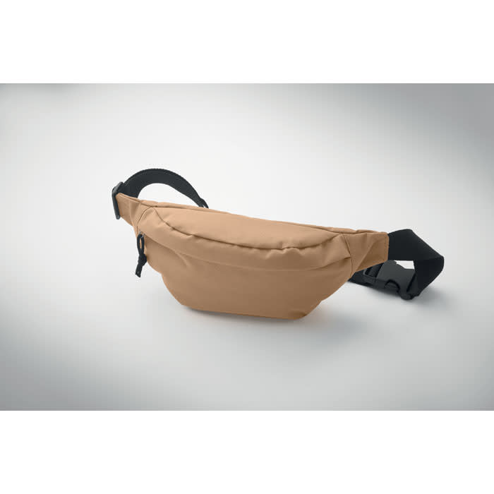 A brown hip bag with a black strap designed for casual use. It features a zippered compartment.