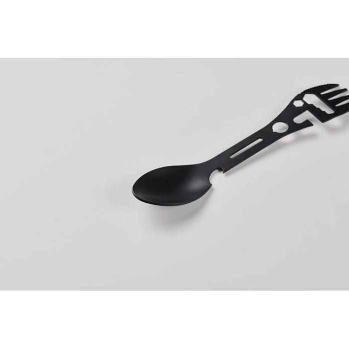 A black multifunctional utensil featuring a spoon and fork design, positioned on a light background.