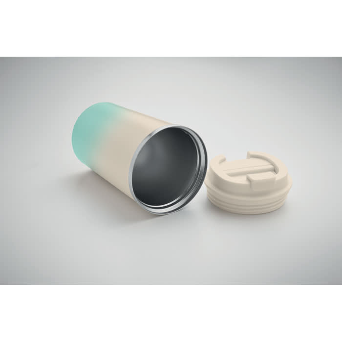 A drink bottle with a gradient from light blue to cream, featuring a removable white lid and a sleek design.