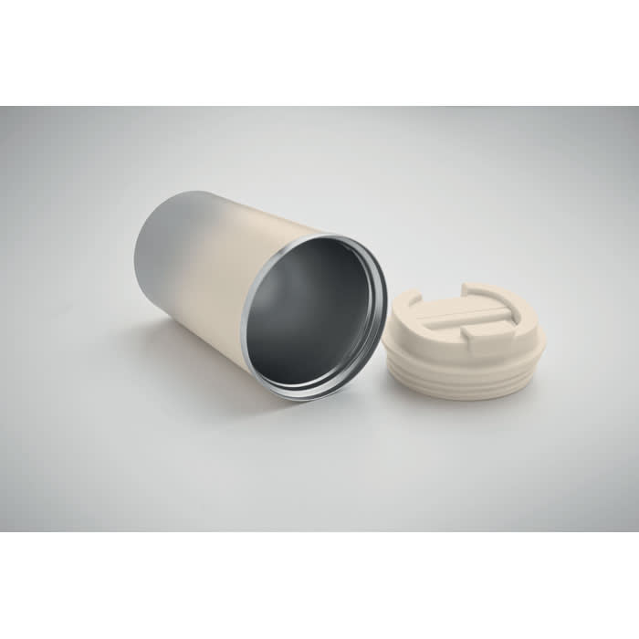 A cylindrical drink bottle in gradient cream and silver, with a removable white lid beside it.