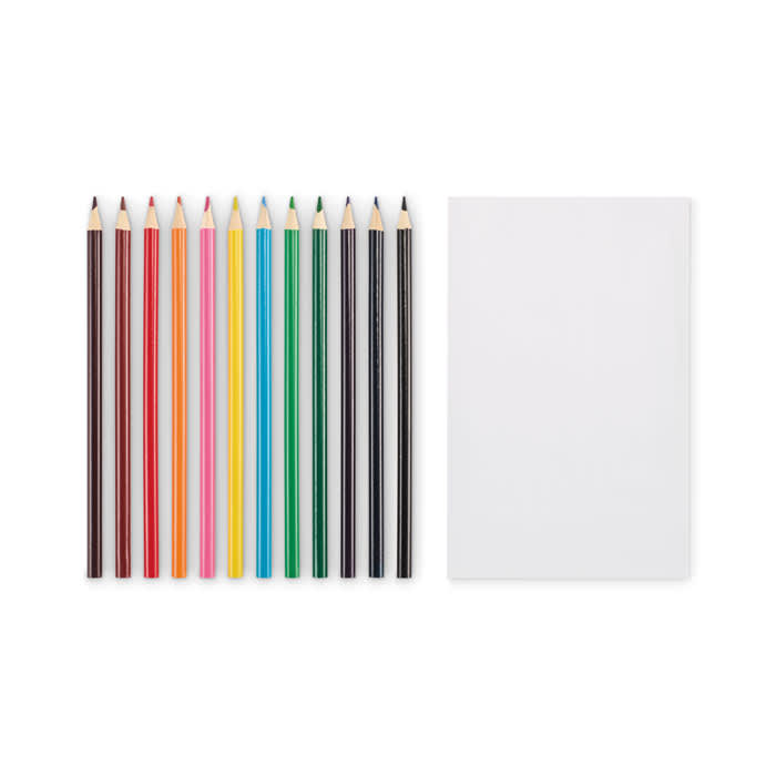 A set of coloured pencils in various shades lined up beside a blank notepad. The pencils are vibrant and include an array of colours.