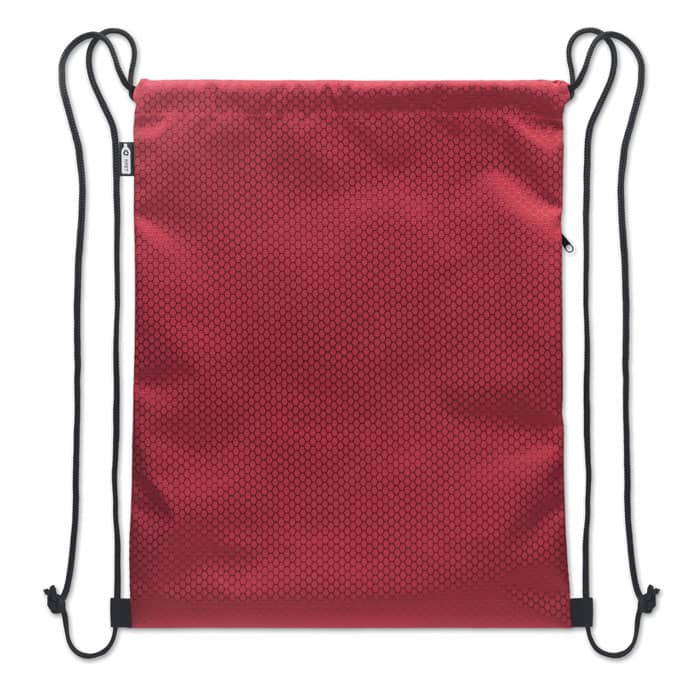 A drawstring backpack in a vibrant red colour with a textured pattern and black shoulder straps.