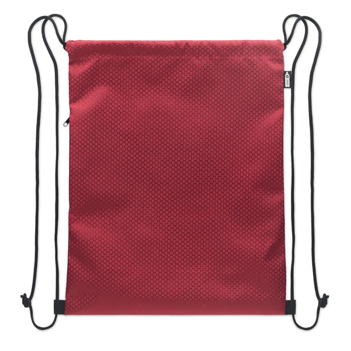 A drawstring backpack in red with a textured surface and black straps. It includes a small zippered pocket.