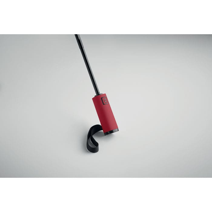 A drink bottle with a red insulated body and a black strap attached to a black lid. It features a logo.