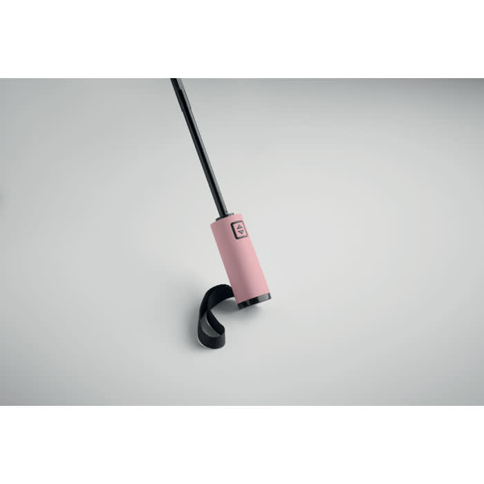A drink bottle in a soft pink colour with a black cap and a flexible strap. It features a logo on the side.