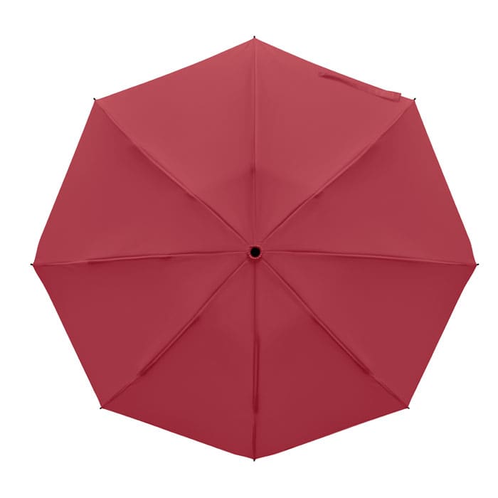 A red umbrella with an octagonal shape, featuring a central opening and no visible branding.