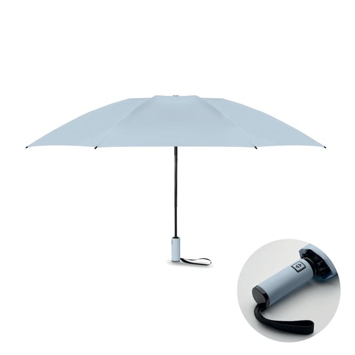 A light blue umbrella with a black handle and a compact design, featuring a logo on the handle.