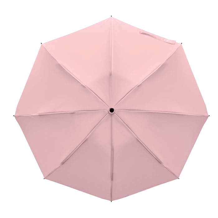 A pink umbrella featuring a smooth surface and eight panels, with a central opening mechanism.