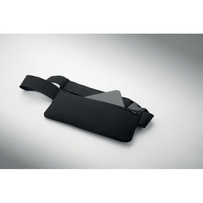 A black waist bag with a zippered compartment, holding a tablet or similar device inside. It features an adjustable strap.