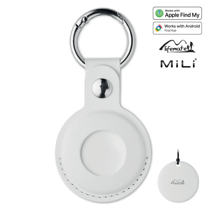 A white keychain accessory with a silver ring and a circular design, featuring a logo on the side.