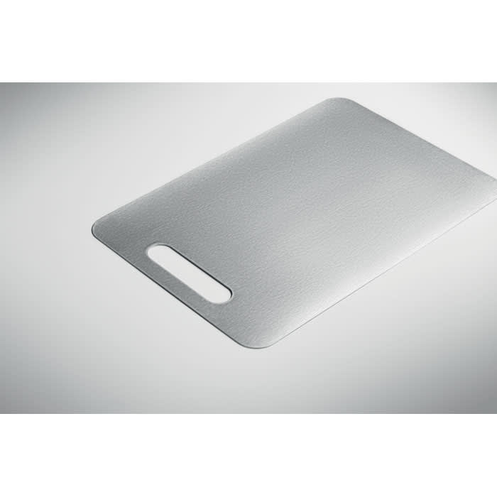 A grey chopping board with a handle, featuring a smooth surface and rounded edges.