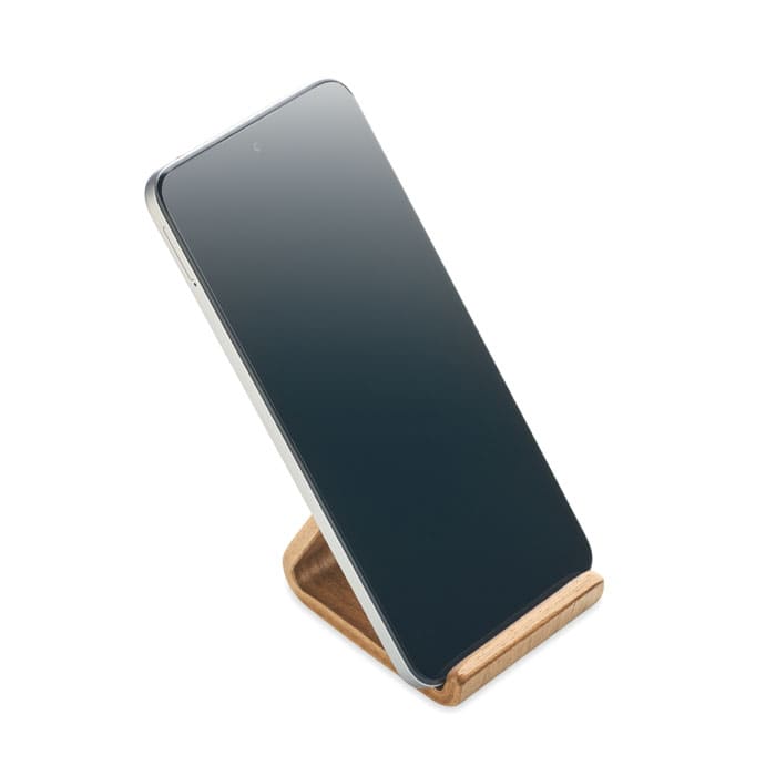 A phone stand made of wood, featuring a sleek design with a phone resting on it. The stand displays a natural wood finish.