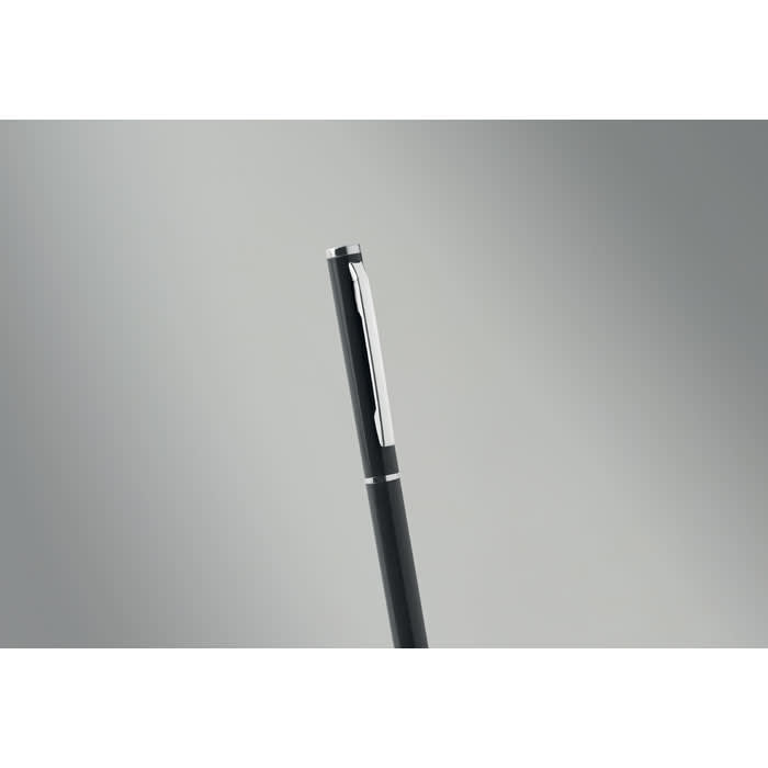 A black pen with a silver clip and accents against a grey background.