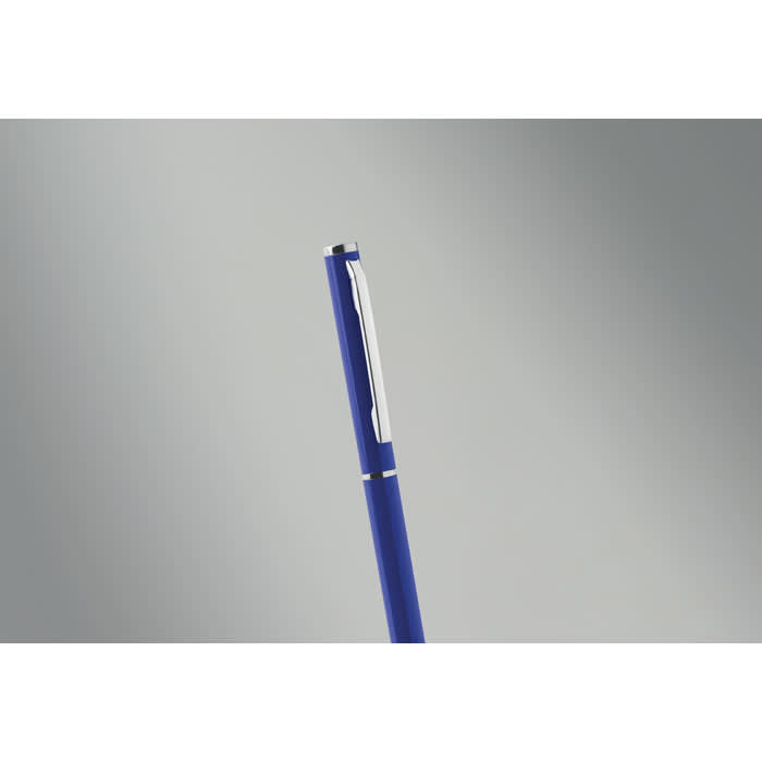 A pen in a vibrant blue colour, featuring a silver clip and detailing. The background is a smooth grey gradient.