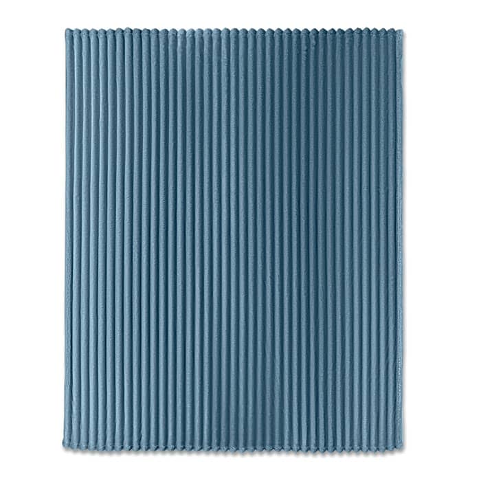 A textured blue rug featuring vertical ribbed patterns, providing a soft, inviting surface.