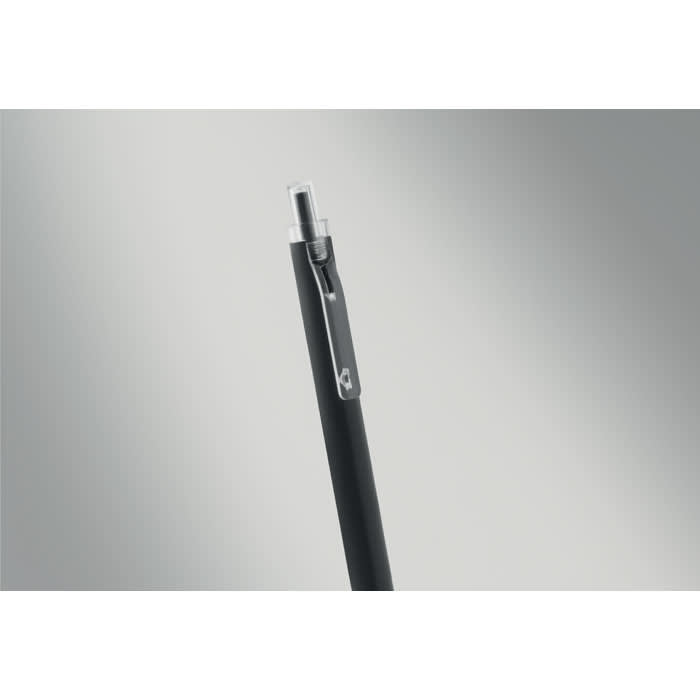 A black pen with a silver clip and a translucent tip, set against a grey background.