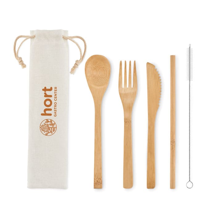 A set of bamboo utensils including a spoon, fork, knife, straw, and cleaning brush, packaged in a natural fabric pouch with a logo.