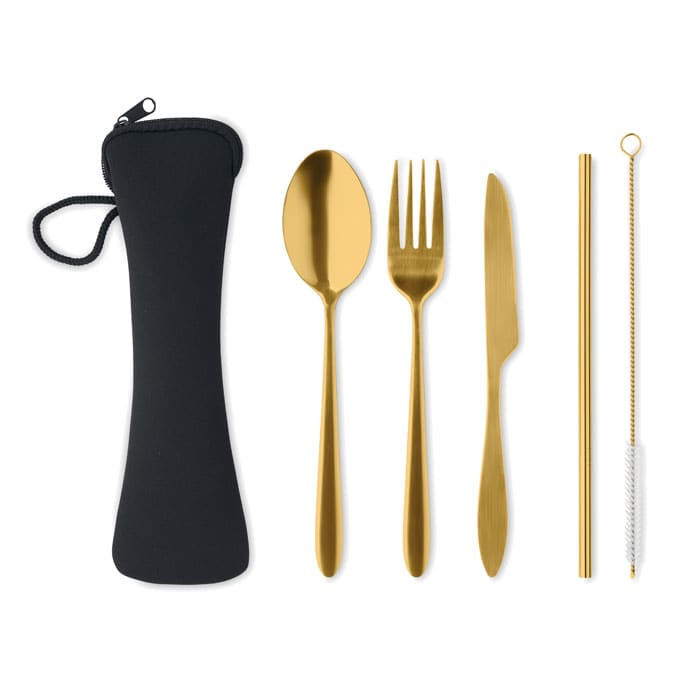 A set of gold plated cutlery including a spoon, fork, knife, and straw, packaged in a black carrying case.
