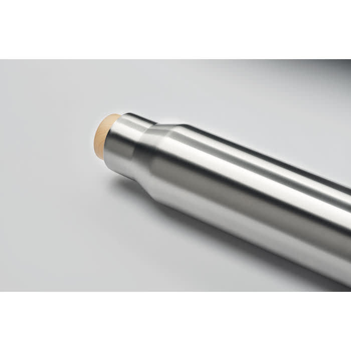 A drink bottle in a stainless steel finish with a smooth, rounded lid, featuring a logo.