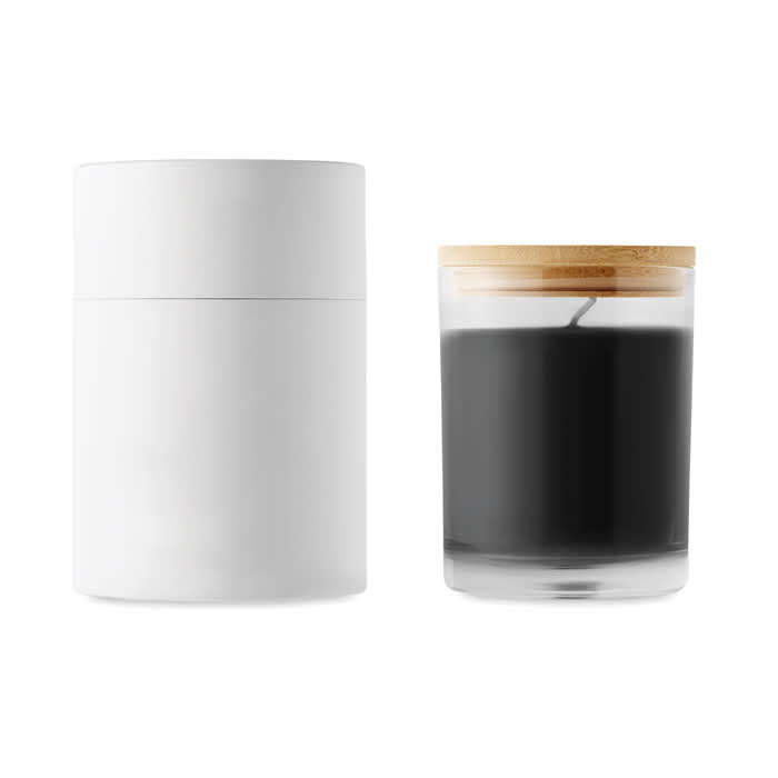 A sleek white candle container next to a black candle in a glass holder, featuring a wooden lid.