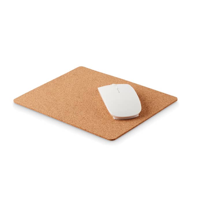 A cork mouse pad with a white mouse resting on it. The surface is smooth and textured.
