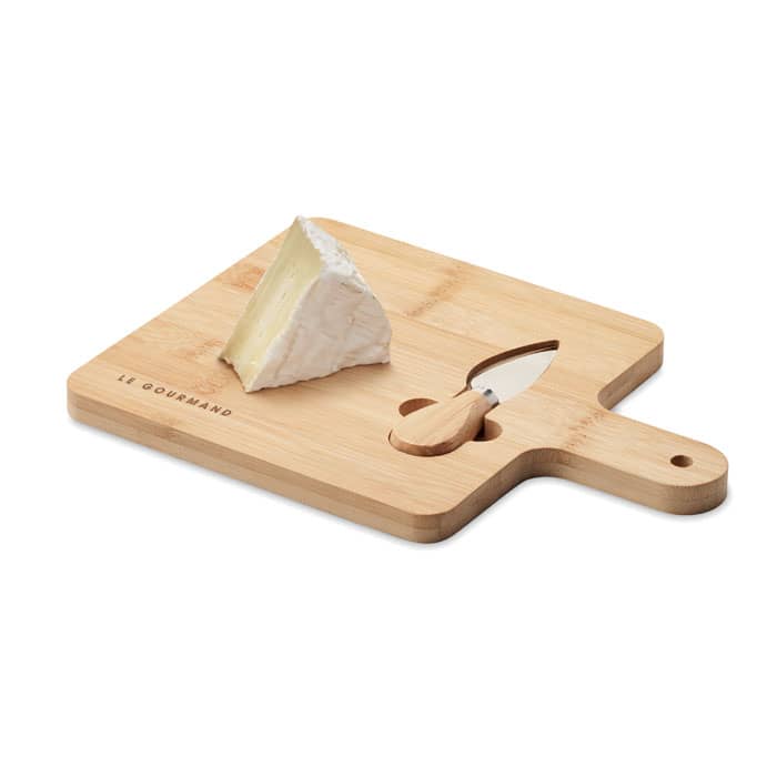 A bamboo cheese board with a wedge of brie cheese and a small knife, featuring a handle and cut-out design.