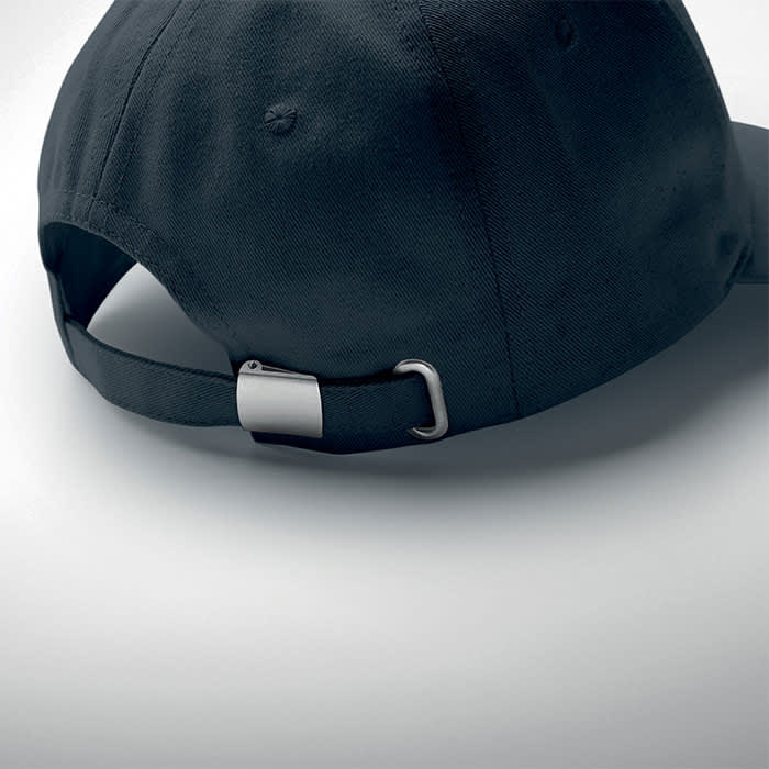 A black cap with an adjustable back strap and a metal fastener, featuring a logo on the side.