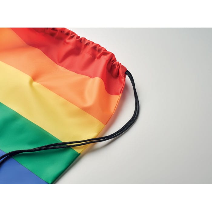 A drawstring bag featuring a vibrant rainbow stripe design, showcasing red, orange, yellow, green, blue, and purple colours.
