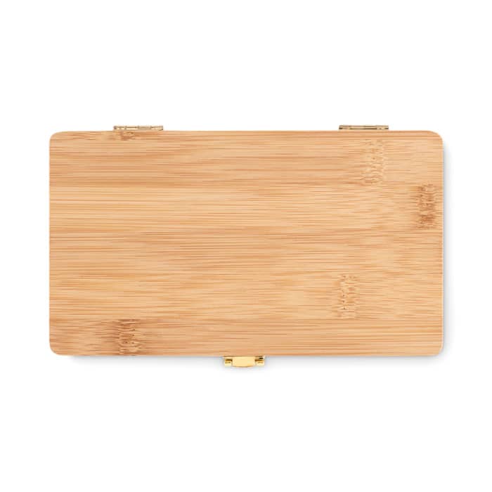 A bamboo chopping board with a smooth, natural finish and gold hinges.