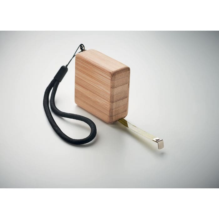 A drink bottle with a wooden finish, featuring a flexible measuring tape and a wrist strap for convenience.