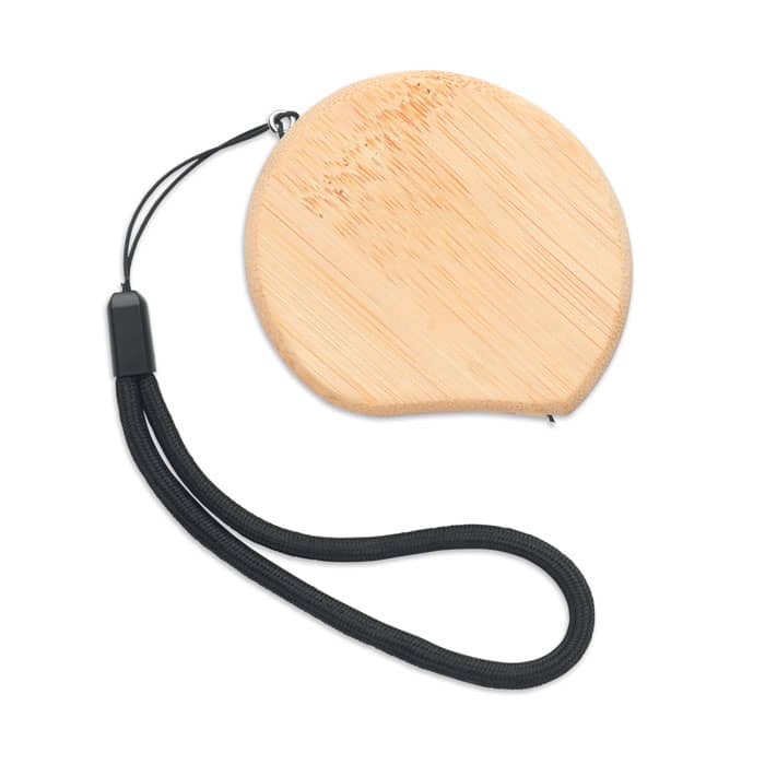 A round bamboo drink coaster with a black textured strap attached.